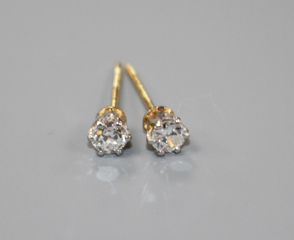 A pair of yellow metal and solitaire diamond earstuds, butterflies stamped 375, gross weight 1.1 grams,